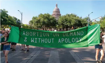  ?? ?? Abortion rights demonstrat­ors march near the state capitol building in Austin, Texas, on 25 June. Photograph: Suzanne Cordeiro/AFP/ Getty Images