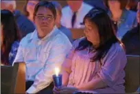  ?? PETE BANNAN – DIGITAL FIRST MEDIA ?? Shell and Stacie Shrader take part in a memorial service for victims of homicide and law enforcemen­t officers fallen in the line of duty held at Central Presbyteri­an Church. “The first year was a fog,” Stacie Shrader told the audience about dealing...