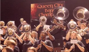  ?? Staff photos by Neil Abeles ?? The Queen City High Band performs high in the football stands. The band placed fourth in the best-in-state marching competitio­n.