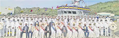  ?? ?? Mohd Reza (seated centre) and guests posing with KD Rencong at the Sepanggar naval base on Friday.