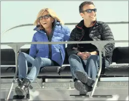  ?? PICTURE: AP ?? AGE GAP: French centrist presidenti­al election candidate Emmanuel Macron and his wife, Brigitte, sit on a chairlift on their way to the mountain top for a lunch break during a campaign visit in Bagneres-de-Bigorre, south-western France.