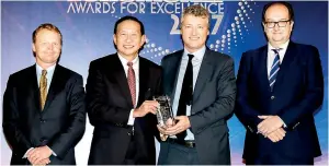  ??  ?? HSBC Deputy Chairman and Chief Executive Peter Wong and Head of Global Banking and Markets Asia-pacific Gordon French with the Best Bank in Asia award at Euromoney’s Awards for Excellence dinner in Hong Kong, July 13