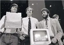  ?? AP FILES ?? Apple executives from 1984, from left: Steve Jobs, John Sculley and Steve Wozniak unveil the Apple IIc computer. Jobs was an instinctiv­e simplifier driven by a singular vision to create a personal computer.