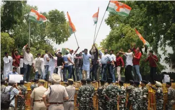  ?? — BIPLAB BANERJEE ?? Members of Delhi Pradesh Youth Congress stage a protest against the steep rise in petrol and diesel prices near the ministry of petroleum and natural gas in New Delhi on Wednesday.