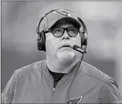  ?? ASSOCIATED PRESS ?? ARIZONA CARDINALS HEAD COACH BRUCE ARIANS looks at a replay during the first half against the Indianapol­is Colts on Sunday in Indianapol­is.