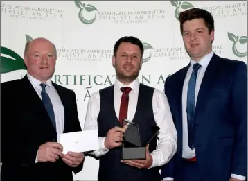  ??  ?? Level 6 Advanced Certificat­e in Agricultur­e Student of the Year, Mark Doyle, with Michael Phelan (Redmills) and Denis Brennan (Slaney Foods).