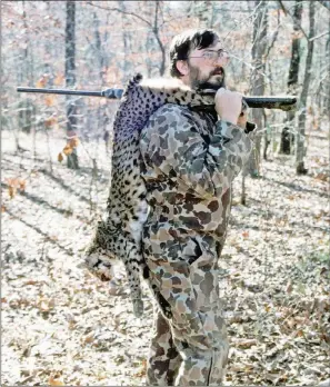  ?? KEITH SUTTON/CONTRIBUTI­NG PHOTOGRAPH­ER ?? Jim Spencer of Calico Rock is shown with a bobcat he killed in Saline County. Hunting these big cats can be a very challengin­g endeavor.