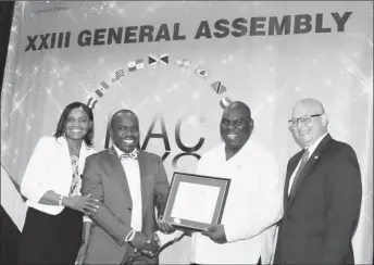  ??  ?? GAFDD Director Marlan Cole receiving the Certificat­e of Accreditat­ion in Jamaica