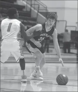  ?? The Sentinel-Record/Mara Kuhn ?? DODGE THIS: Fountain Lake forward Cade Dodge (35) drives the ball as Malvern’s Demias Jimerson (1) defends Thursday night at the Leopard Center. Fountain Lake will face Bigelow on Wednesday and Perryville on Thursday in the Perry County Classic at...