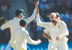  ?? Picture: GETTY ?? PRIZE WICKET: Nathan Lyon celebrates dismissing Indian captain Virat Kohli.