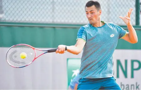  ??  ?? ONE DOWN: Bernard Tomic in his first-round French Open qualifying win yesterday. Picture: GETTY IMAGES
