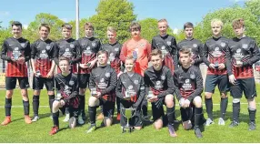  ??  ?? The St Murdoch’s U/15 side pose triumphant­ly with the J Bolton Cup after seeing off Monifieth Athletic 2-1.
