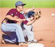  ?? ROBERTO E. ROSALES/JOURNAL ?? Dylan DiLorenzo of St. Pius beats the throw to third base as Belen’s Henry Jaramillo looks to apply the tag. The Sartans went on to win the first-round state tournament game, 5-0.