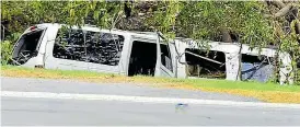  ??  ?? Horror smash... the stretch limo lies in a ditch after crashing in New York on Saturday, killing 20 people