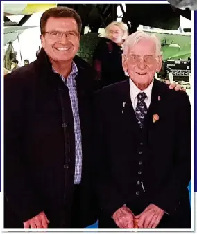  ??  ?? POIGNANT MOMENT: John Nichol with former rear gunner Ron Needle pose in front of a Lancaster bomber during their visit to the RAF Museum