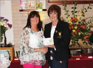  ??  ?? Patricia Magee receiving her prize from Coolaatin Golf lady captain Mary Kavanagh.