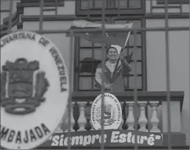  ??  ?? A life-size cutout of Venezuela’s late President Hugo Chavez waving his nation’s flag stands on a balcony at Venezuela's embassy in Lima, Peru. Peru’s government has expelled Venezuela’s ambassador as regional pressure builds on President Nicolas...