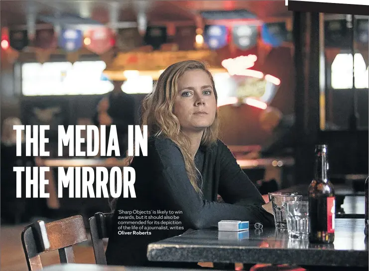  ??  ?? Amy Adams as Camille Preaker with the journalist­ic trademark of cigarettes and booze.