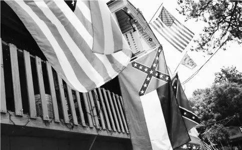  ?? — WP-Bloomberg photo ?? The Mississipp­i flag flies at the Neshoba County Fair in Philadelph­ia, Missssippi.