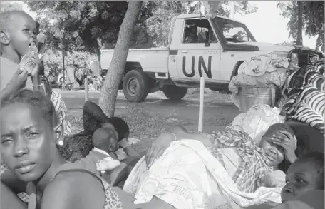  ?? Beatrice Mategwa AFP/Getty Images ?? CIVILIANS HAVE BEEN taking shelter in a compound in South Sudan’s capital, Juba. At least 7,000 people have fled their homes to take refuge in the sites run by the U.N. peacekeepi­ng force, the United Nations Mission in the Republic of South Sudan.