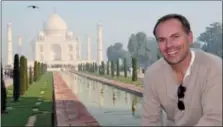  ?? NATALIE DISCALA VIA AP ?? This undated photo shows John DiScala, better known as the air travel expert Johnny Jet, at the Taj Mahal in Agra, India. DiScala offered tips and strategies for booking flights and getting the best deals for summer travel in an interview with the AP Travel podcast “Get Outta Here!”