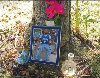  ?? ?? A memorial for Christophe­r Roberts Jr., who was killed in a 2020 shooting in the parking lot of a Safeway store in Seattle’s Rainier Beach neighborho­od, is shown July 12 near where the shooting took place.