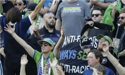  ??  ?? A sign that reads ‘Anti-Facist Always Seattle Anti-Racist’ is displayed in the supporters section during an MLS match between the Sounders and the Timbers in Seattle. Photograph: Ted S Warren/AP