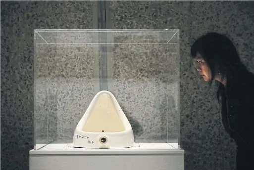  ?? DAN KITWOOD GETTY IMAGES ?? Marcel Duchamp purchased a urinal from a plumbing store, labelled it Fountain and sent it to an art show. A replica of the work sold for $1.7 million in 1999.