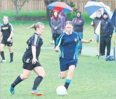  ??  ?? FIFTY/ FIFTY: Holly Inwood (Kerikeri High School, on right) and Chelsea Downey (Kerikeri Siteworx) contest the ball in round 7 of the Northland Women’s Premier Division at Kerikeri High School on a wet Sunday afternoon. The host team won the Far North...