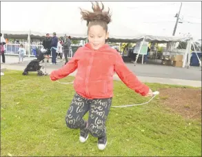  ?? Alex von Kleydorff / Hearst Connecticu­t Media ?? Yaribel Monzon, of Norwalk, keeps moving while jumping rope during the Norwalk Community Health Center 3k Fun Walk at Calf Pasture beach to raise awareness and funds to fight childhood obesity on Sunday in Norwalk.