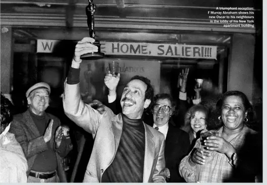  ?? ?? A triumphant reception: F Murray Abraham shows his new Oscar to his neighbours in the lobby of his New York apartment building