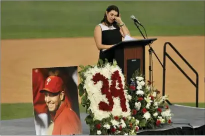  ?? STEVE NESIUS — THE ASSOCIATED PRESS ?? Brandy Halladay, widow of Roy Halladay, talks about her husband during a memorial tribute at the Phillies’ spring training stadium Tuesday in Clearwater, Fla.