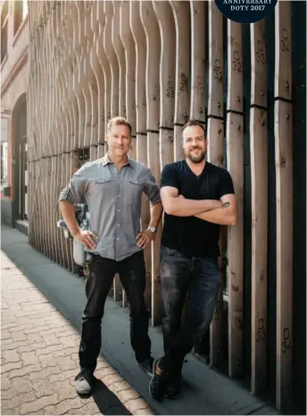  ??  ?? Past and Present Ben Klumper and Dustin Couzens of MoDA (above, right) were commission­ed to convert a large house into a mixed-use commercial structure in Canmore, Alberta (left and centre). Rather than demolishin­g the house, they “ghosted” it in white...