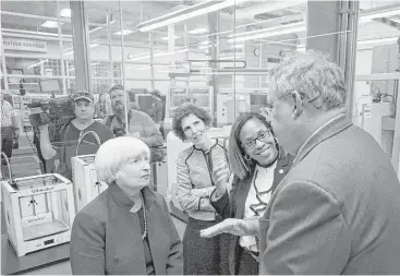  ?? Dake Kang / Associated Press ?? Federal Reserve Chair Janet Yellen speaks to Arthur Anton, CEO of Swagelok, a manufactur­ing company, during a job training tour Tuesday in Cleveland. She said the Fed is puzzled by unusually low inflation.