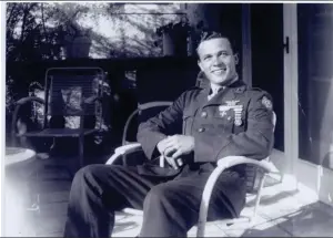  ??  ?? Above, Scotty Bowers in uniform in the film “Scotty and the Secret History of Hollywood.”