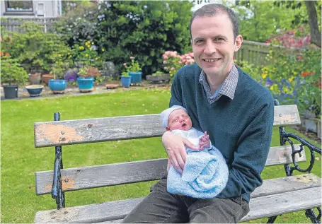 ?? Picture: Steven Brown. ?? Stephen Gethins, the SNP candidate for North East Fife, at home with his son Patrick.