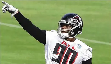  ?? CURTIS COMPTON / CCOMPTON@AJC.COM ?? Falcons rookie defensive tackle Marlon Davidson makes a point during training camp Saturday in Flowery Branch. The rookie from Auburn is working at defensive tackle and defensive end.