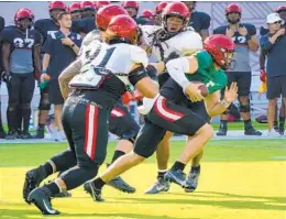  ?? NELVIN C. CEPEDA U-T ?? Aztecs QB Braxton Burmeister (green jersey) runs on a keeper during the team’s scrimmage game at Snapdragon Stadium on Saturday.