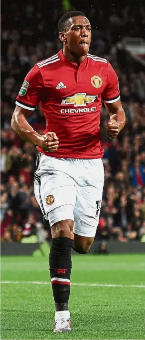  ??  ?? In fine form: Manchester United striker Anthony Martial celebratin­g after scoring against Burton Albion during the English League Cup third round match at Old Trafford on Wednesday. — AFP