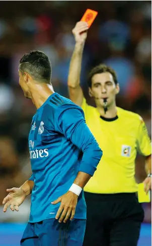  ??  ?? Persecutio­n? Cristiano Ronaldo is sent off by Ricardo de Burgos