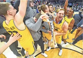  ?? BOB DONNAN/USA TODAY SPORTS ?? The UMBC Retrievers celebrate beating the Virginia Cavaliers in the first round of the 2018 NCAA Tournament.