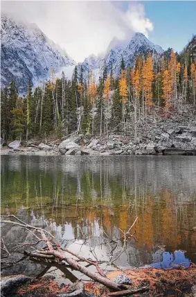  ?? Michael Naiman/Seattle Post-Intelligen­cer file photo ?? A reflection of Colchuch Peak in Colchuck Lake near The Enchantmen­t Lakes wilderness in Washington. A 53-year-old Connecticu­t man was among three climbers killed Sunday in an avalanche in central Washington, officials said.