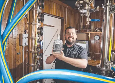  ?? Picture: Kevin Farmer ?? HIGH SPIRITS: Pechey Distilling Co chief distiller Ben Pechey with a bottle of their newly-launched 1868 Vodka.