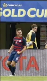  ?? RON SCHWANE — THE ASSOCIATED PRESS ?? Kelyn Rowe (6) celebrates after scoring a goal against Nicaragua during a CONCACAF Gold Cup match in Cleveland, Saturday.