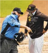  ?? K.C. ALFRED U-T ?? Padres skipper Jayce Tingler gets thrown out by umpire Tom Hallion in the eighth inning.