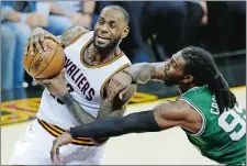  ?? TONY DEJAK/AP PHOTO ?? Cleveland’s LeBron James, left, drives past Boston’s Jae Crowder during Game 4 on Tuesday night. The Cavaliers won 112-99 and can advance to the NBA Finals with a win in Game 5 tonight in Boston.