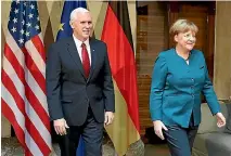  ?? PHOTO: REUTERS ?? German Chancellor Angela Merkel with US Vice President Mike Pence at the 53rd Munich Security Conference in Munich.