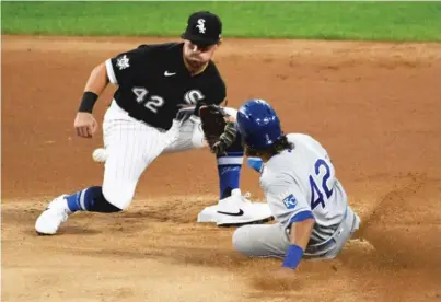  ?? DILIP VISHWANAT (DYSON), DAVID BANKS/GETTY IMAGES ?? The White Sox acquired outfielder Jarrod Dyson (left) from the Pirates and started Danny Mendick (above) at second base Friday even though Nick Madrigal returned from the 10-day injured list.