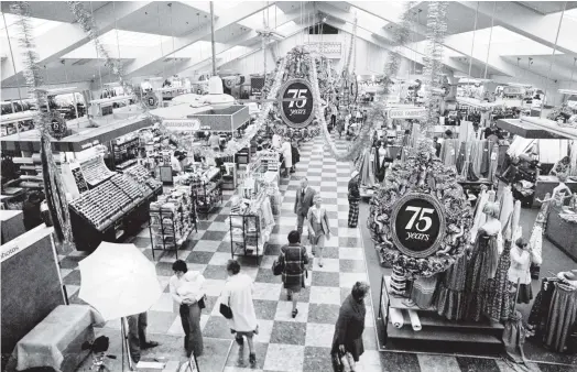  ?? PHOTO EVENING STAR ?? There was a festive scene in the interior of Arthur Barnett Ltd in October 1978 as the store celebrated its 75th anniversar­y.