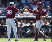  ?? JOHN PETERSON — THE ASSOCIATED PRESS ?? Oklahoma pitcher Trevin Michael and catcher Jimmy Crooks shake hands after their win Wednesday over Texas A&M.